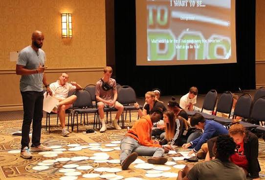Omari Pearson leading a goal mapping workshop with students on the floor
