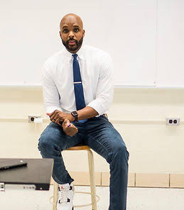 Omari Pearson seated during a classroom session with students